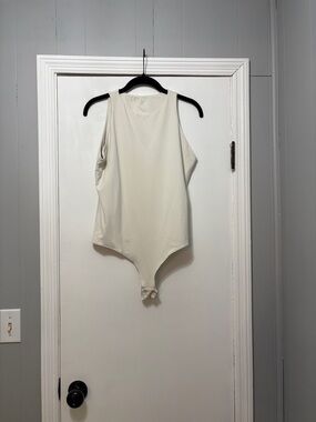 Sleek Sleeveless Cream Bodysuit - Minimalist Women's Top